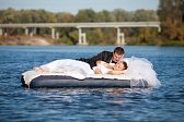 18063625-newlyweds-are-floating-down-the-river.jpg