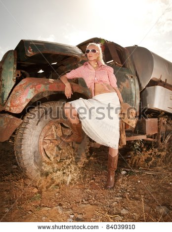 stock-photo-attractive-blond-woman-near-an-old-truck-84039910.jpg