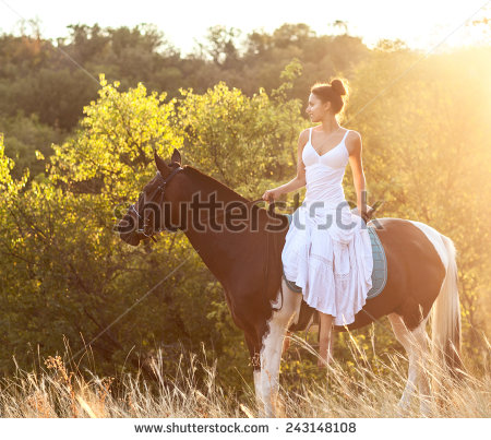 stock-photo-beautiful-woman-on-a-horse-horseback-rider-243148108.jpg
