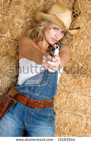 stock-photo-cowgirl-with-gun-15183544.jpg