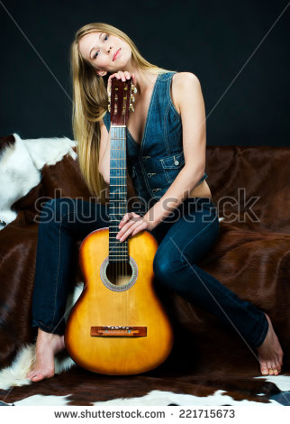 stock-photo-portrait-of-the-beautiful-musician-with-guitar-221715673.jpg