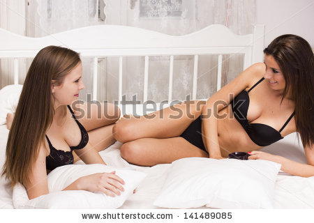 stock-photo-sexy-female-couple-in-lingerie-on-the-bed-141489085.jpg