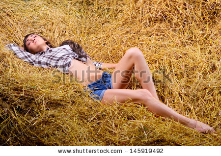 stock-photo-young-woman-lying-on-haystack-145919492.jpg